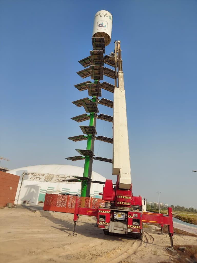 Boom raised beside a solar lighting tower